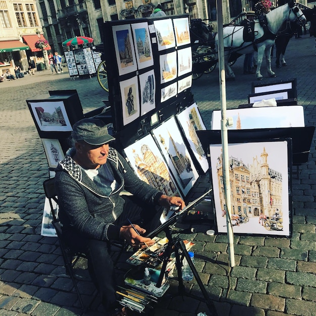 A collection of diverse stock photos displayed on a large monitor, showcasing various subjects and styles, such as landscapes, portraits, and urban scenes. The display is bright and vibrant.
