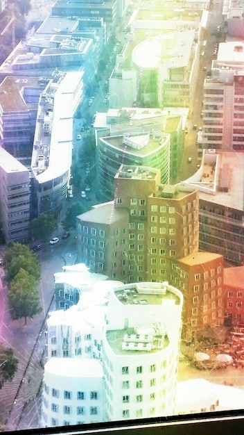 A collage of various types of properties managed by REITs: apartment buildings, office spaces, shopping malls, and data centers. Highlighting the diversity of REIT investments.