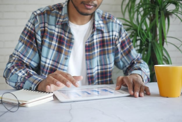 A freelancer using a budget planning app on their tablet, showcasing income, expenses, and financial goals for 2025. The app displays charts and graphs, illustrating a clear path to financial success.