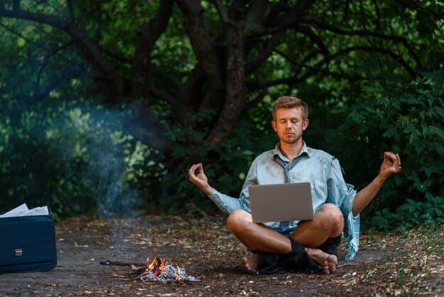 A freelancer practicing yoga outdoors in a serene setting, with a laptop and a cup of tea nearby, symbolizing a balanced approach to work and well-being.