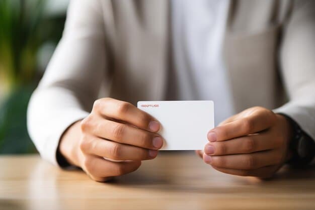 A close-up shot of a hand pulling cash out of an envelope labeled 