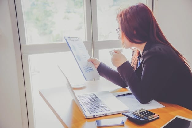 A person reviewing financial documents and using a calculator, with a laptop displaying budgeting software in the background, symbolizing meticulous planning and the use of technology to create a realistic retirement budget.