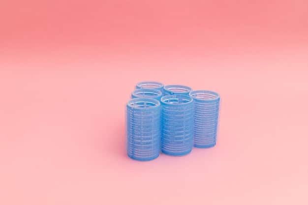 A visual representation of a credit card and a stack of coins, illustrating increased debt costs and consumer financial burden.