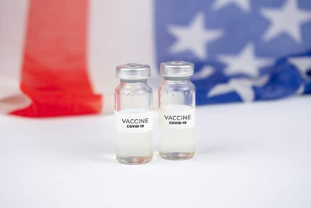 A close-up shot of vaccine vials labeled with 