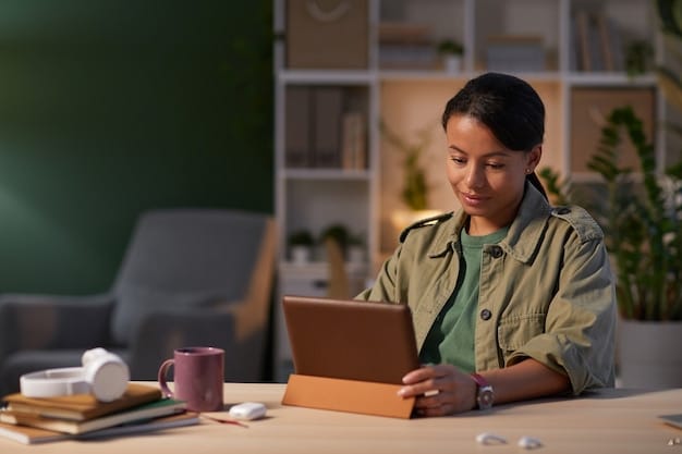 A student sitting comfortably at a desk, looking intently at a tablet screen, possibly taking the digital SAT. The setting is bright and modern.