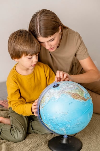 A parent and child engaged in a home learning activity, using a globe and books, representing parental involvement in education.