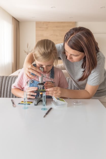 A parent and child working together on a complex LEGO Technic build, representing shared problem-solving and engagement in engineering at home.