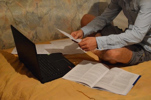 A close-up shot of a student meticulously writing on a laptop, surrounded by open books and notes, symbolizing dedicated work on a scholarship application. The student's face shows concentration and determination.