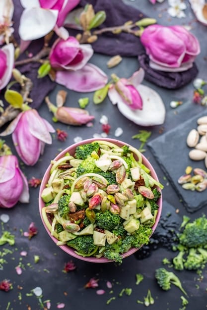 A close-up shot of a colorful salad bowl filled with fresh greens, berries, nuts, and a light vinaigrette, emphasizing healthy eating for cardiovascular health.