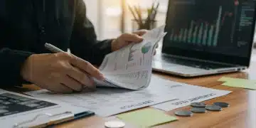 Person organizing financial documents for 2026 interest rate hike preparedness